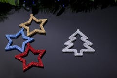 Making shiny decorative stars of different colors stock photo Making shiny decorative stars of different colors stock photo