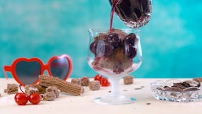 Making summertime gourmet chocolate cherry and coconut ice cream sundae. Stock Images Making summertime gourmet chocolate cherry and coconut ice cream sundae. Stock Images