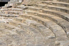 Malaga, Spain. Roman theater at the walls of the Alcazaba. Massive stone steps of the theater. Ruin stock photo Malaga, Spain. Roman theater at the walls of the Alcazaba. Massive stone steps of the theater. Ruin stock photo