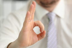 Male arm show OK or confirm during conference in office stock images Male arm show OK or confirm during conference in office stock images