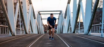 Male athlete running over sunset background royalty free stock photos Male athlete running over sunset background royalty free stock photos