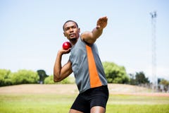 Male athlete about to throw shot put ball stock photos Male athlete about to throw shot put ball stock photos