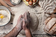 Male baker prepares bread stock images Male baker prepares bread stock images