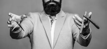 Male in barbershop. Mens haircut in barber shop. Barber scissors and straight razor, barber shop. Mens haircut, shaving stock images Male in barbershop. Mens haircut in barber shop. Barber scissors and straight razor, barber shop. Mens haircut, shaving stock images