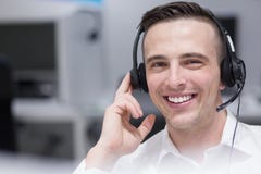 Male Call Centre Operator Doing His Job Stock Photos Male Call Centre Operator Doing His Job Stock Photos