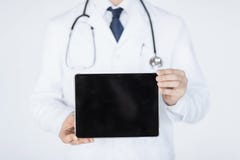 Male doctor holding tablet pc Royalty Free Stock Images Male doctor holding tablet pc Royalty Free Stock Images