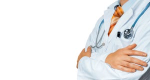 Male Doctor In White Coat With A Stethoscope Crosses His Arms Over His Chest Copy-space. Healthcare Medicine Concept royalty free stock images Male Doctor In White Coat With A Stethoscope Crosses His Arms Over His Chest Copy-space. Healthcare Medicine Concept royalty free stock images