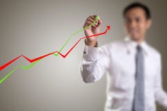 Male hand drawing a graph royalty free stock image Male hand drawing a graph royalty free stock image