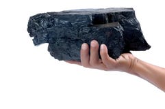Male Hand Holding A Big Lump Of Coal Royalty Free Stock Photos