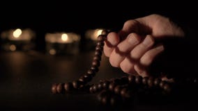 Male Hand Holding Rosary Beads Royalty Free Stock Photo
