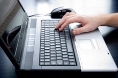 Male hand pushing the enter button Male hand pushing the enter button