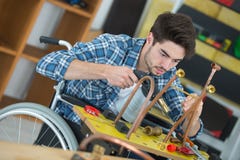 Male handicapped conductor assembler stock photo Male handicapped conductor assembler stock photo