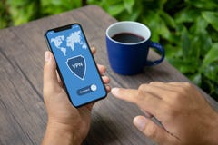 Male hands holding phone with app vpn creation Internet protocol stock photos Male hands holding phone with app vpn creation Internet protocol stock photos