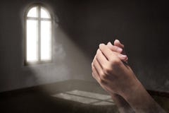 Male hands in praying position inside the room stock photography Male hands in praying position inside the room stock photography