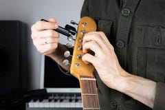 Changing electric guitar strings royalty free stock photos Changing electric guitar strings royalty free stock photos