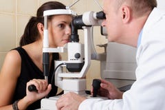 Male ophthalmologist conducting an eye examination