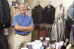 Male sales assistant in clothing store Royalty Free Stock Images Male sales assistant in clothing store Royalty Free Stock Images