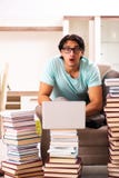 The male student with many books at home royalty free stock photos The male student with many books at home royalty free stock photos