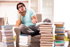 The male student with many books at home royalty free stock photography The male student with many books at home royalty free stock photography