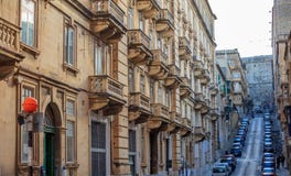 Malta, Valletta, Building Facade With Balconies, Perspective View Royalty Free Stock Image