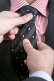Man Adjusting His Tie... Royalty Free Stock Photos Man Adjusting His Tie... Royalty Free Stock Photos