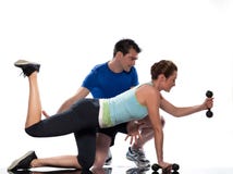 Man aerobic trainer positioning woman Workout Royalty Free Stock Photos Man aerobic trainer positioning woman Workout Royalty Free Stock Photos