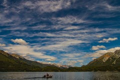 man alone with his boat on the lake stock image man alone with his boat on the lake stock image
