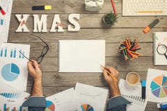 Man analyzes the annual reports, top view stock photo Man analyzes the annual reports, top view stock photo