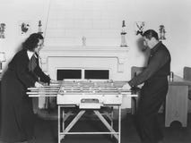 Man And Woman Playing Foosball Royalty Free Stock Photography Man And Woman Playing Foosball Royalty Free Stock Photography