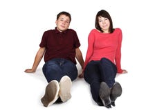 Man And Woman Sitting On Floor, Front View Royalty Free Stock Photo