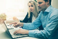 Man And Woman Working Together In Office Stock Photo Man And Woman Working Together In Office Stock Photo