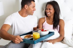 https://thumbs.dreamstime.com/t/man-bringing-woman-breakfast-bed-tray-smiling-to-each-other-31163842.jpg