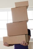 Man Carrying Stacked Boxes Royalty Free Stock Images