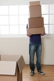 Man Carrying Stacked Boxes Stock Images