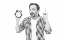 Man casual style hold alarm clock. Time management and procrastination. Take control of time. Check time. Idea of royalty free stock photography Man casual style hold alarm clock. Time management and procrastination. Take control of time. Check time. Idea of royalty free stock photography