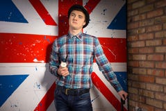 Man in Checkered Shirt and Jeans In Front UK Flag royalty free stock photography Man in Checkered Shirt and Jeans In Front UK Flag royalty free stock photography