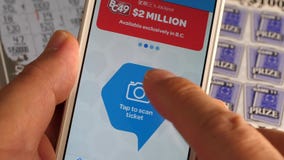 Man checking lottery ticket by app. Motion of man checking lottery ticket by app Man checking lottery ticket by app. Motion of man checking lottery ticket by app