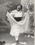 Man in clown shoes dressed in drag stock photo Man in clown shoes dressed in drag stock photo
