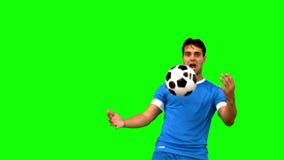 Man controlling a football with his chest on green screen