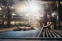 Man cooking at a stand in Mercato Metropolitano market in London, UK stock photos Man cooking at a stand in Mercato Metropolitano market in London, UK stock photos