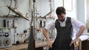 Man dress the lab coat before the chemical experiments stock video footage Man dress the lab coat before the chemical experiments stock video footage