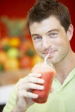 Man Drinking A Berry Smoothie royalty free stock photos Man Drinking A Berry Smoothie royalty free stock photos
