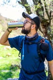 Man drinking from a insulated bottle royalty free stock image Man drinking from a insulated bottle royalty free stock image