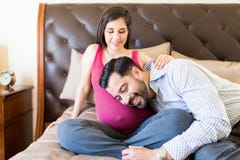 Man Feeling Movement Of Baby In Wife`s Abdomen stock photos Man Feeling Movement Of Baby In Wife`s Abdomen stock photos