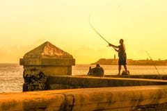 Man Fishing During A Sunset In Havana Stock Photography