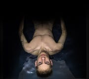 Man Floating In A Sensory Deprivation Isolation Tank