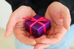 Man gifting small present