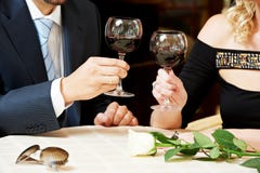 Man and girl hands with wine at cafe on a date royalty free stock photography Man and girl hands with wine at cafe on a date royalty free stock photography