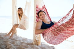 Man and girlfriend relaxing at the beach stock photos Man and girlfriend relaxing at the beach stock photos