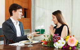 https://thumbs.dreamstime.com/t/man-giving-present-to-young-woman-romantic-dinner-women-home-44468619.jpg